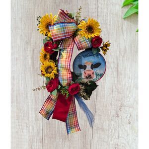 Decorative farmhouse-style/rustic Welcome cow on grapevine form wreath